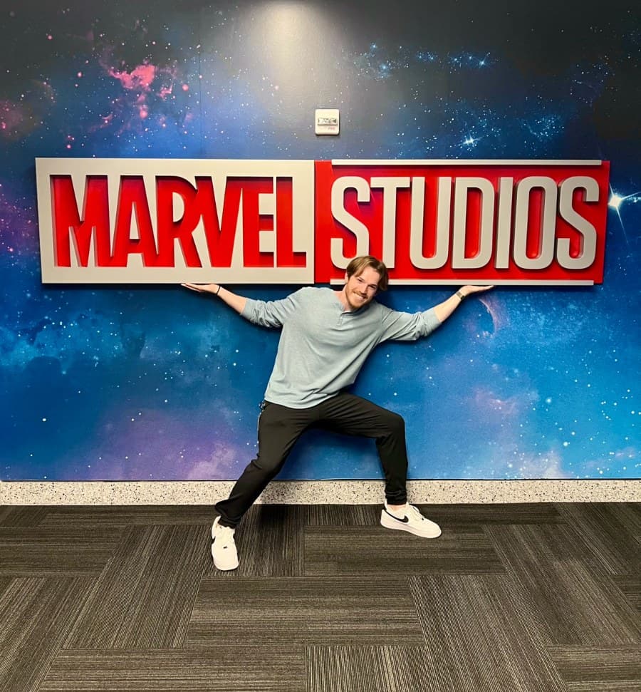 Josiah Rininger at the Marvel Studios sign